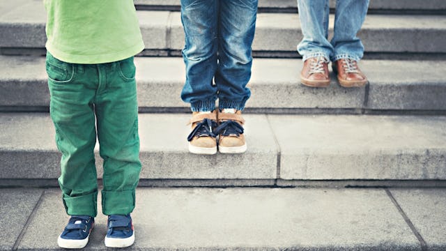 Children consecutively standing on stairs