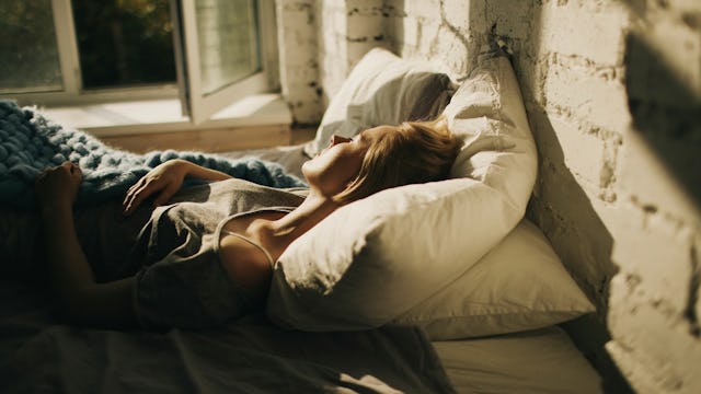A depressed woman spending her day in bed