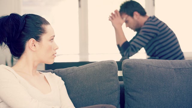 Spouses, sitting in a living room after an argument
