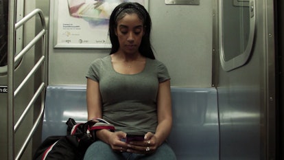 A woman sitting in a train thinking about what it's like being a woman in this world