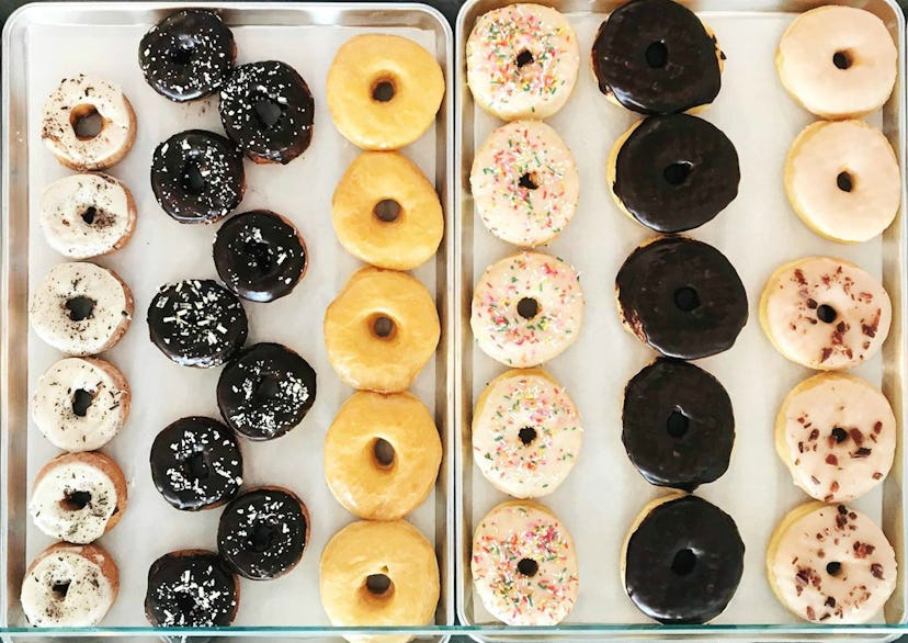 A baking tray full of colorful doughnuts from Kingston Pike bakery