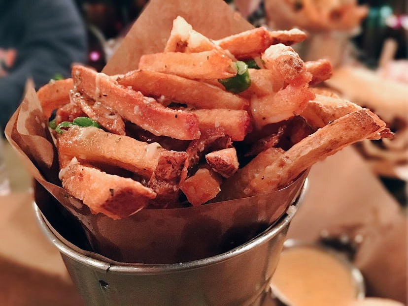 Duck confit fries served in a bowl