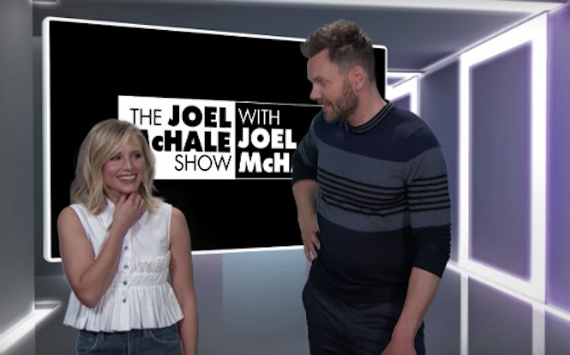 Kristen Bell and Joel McHale in his show speaking and smiling