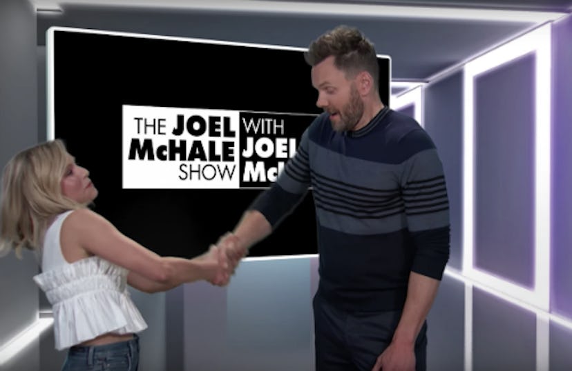 Kristen Bell and Joel McHale shaking hands in his show