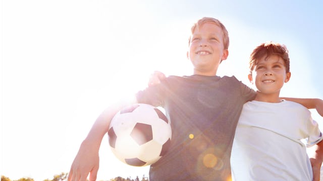 brothers with soccer ball