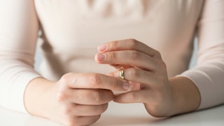 Woman taking her wedding ring off