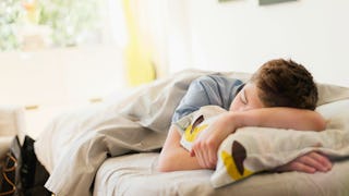 A man laying on the couch dreaming his son could walk and talk 