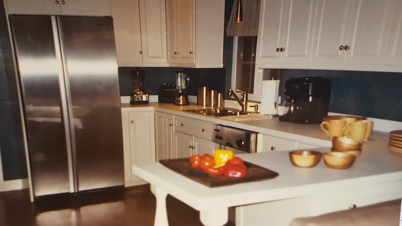 A luxurious-looking kitchen with numerous golden details