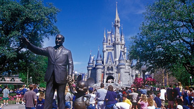 A Disney World location with a statue of Walt Disney