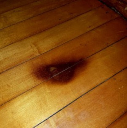 A burnt spot on a wooden floor