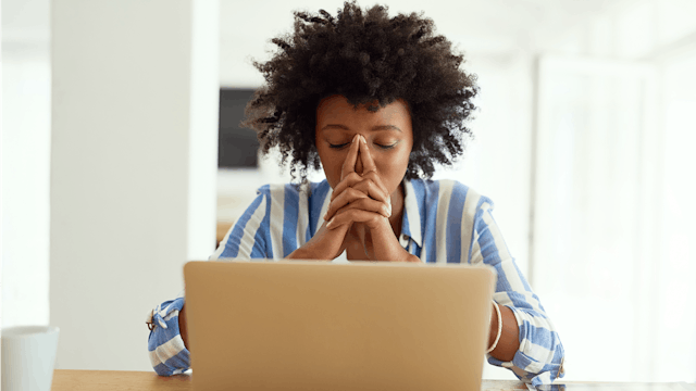 Concerned women sitting in front of her laptop