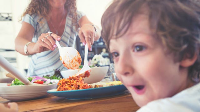A little boy getting excited about family dinner