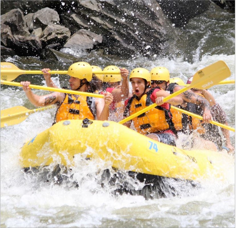 A group of visitors on a whitewater rafting trip.