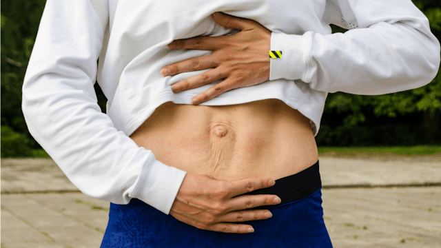 A stomach representing prevention of diastasis recti during pregnancy and postpartum