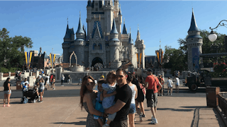 Alessandra Macaluso with her husband and their children at Disneyland when her son wore a dress
