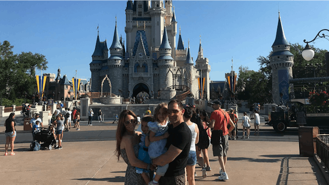 Alessandra Macaluso with her husband and their children at Disneyland when her son wore a dress