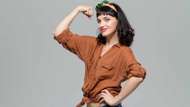A confident young woman posing as she's showing off her independency