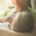 A mom breastfeeding her son in public