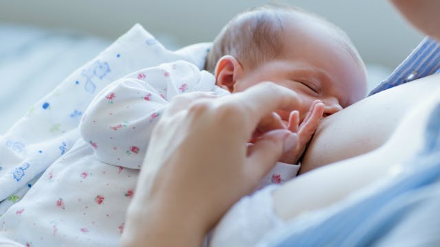 A mother breastfeeding her newborn baby