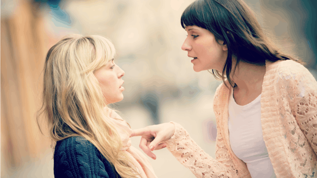 Woman bullying another woman
