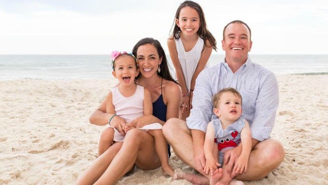 Parents with the kids and a toddler on the beach