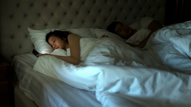 Husband and wife lying in the bed 