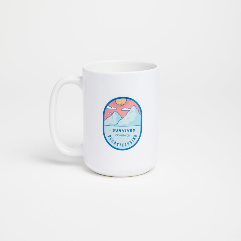 A white mug with the print I Survived Breastfeeding in front of a white background
