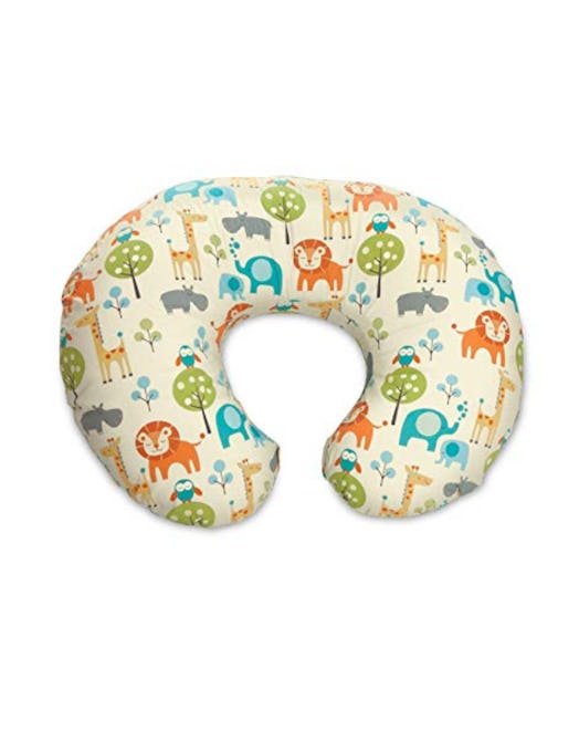A Boppy white pillow with different animals painted on it
