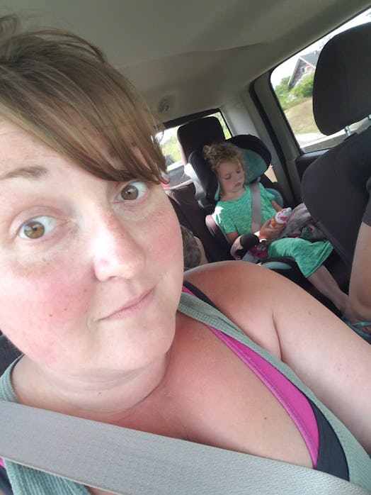 Kira Gilbertson taking a selfie with her daughter in the car before going back home after camping