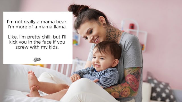 A woman in a grey shirt with ear plugs who is holding her baby boy in bed, hugging and smiling with ...