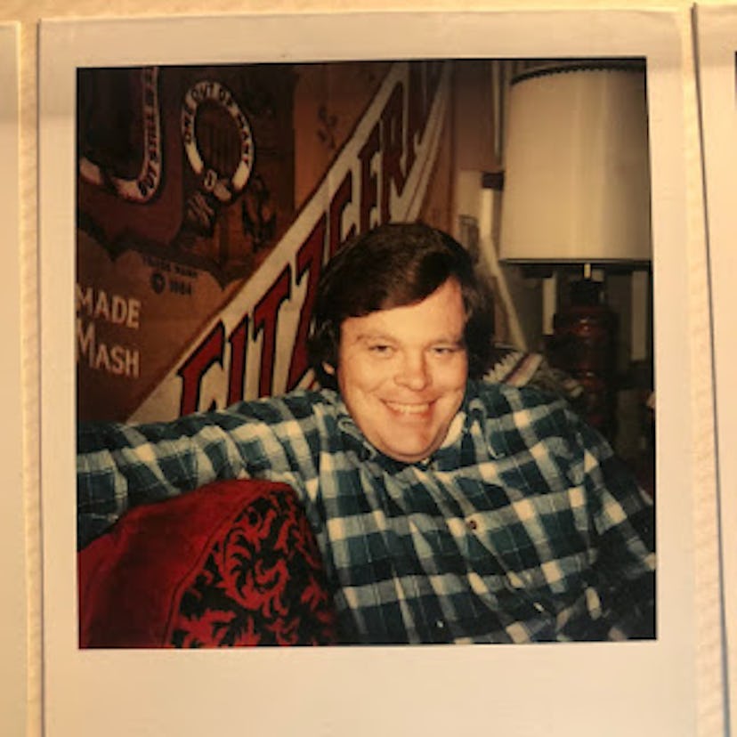 A photograph of Patsy's father sitting leaned against an old Fitz billboard wallpaper