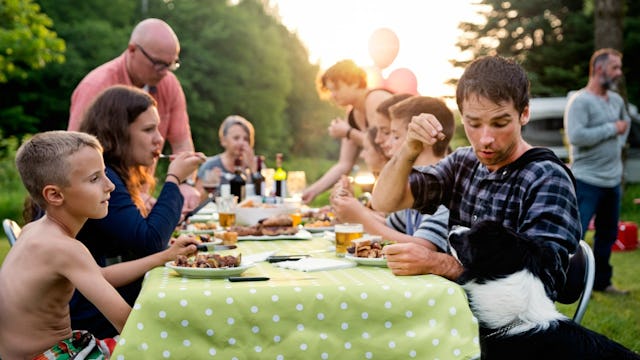 A  mother of eight and the rest of her family at an outdoor dinner gathering
