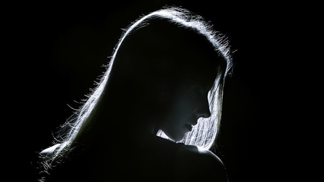 woman looking to the side symbolizing the sadness of being raped