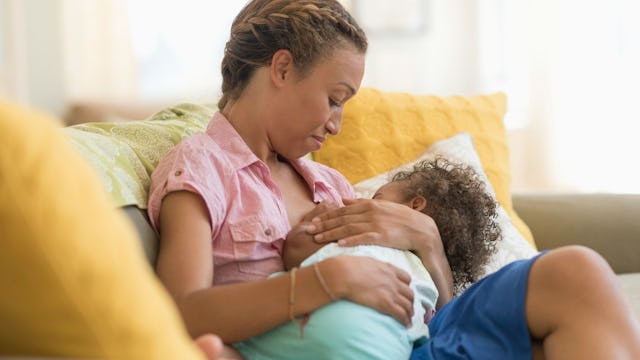 A mother breastfeeding her child
