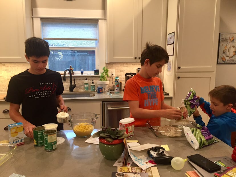  Three brothers in a kitchen preparing a meal 