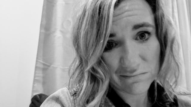 Suzanne Hayes taking a selfie as a socially awkward mom