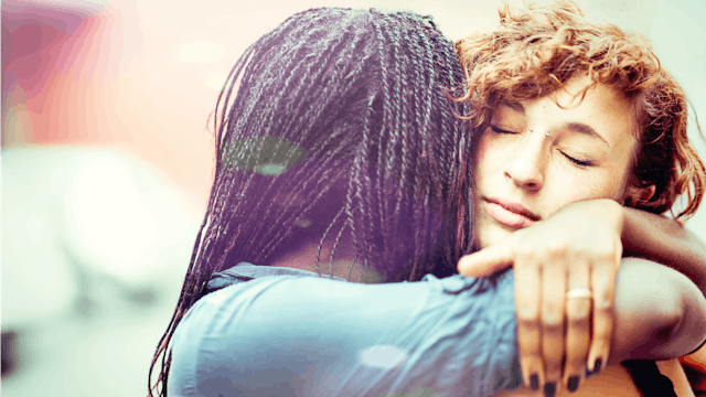 Two female friends hugging