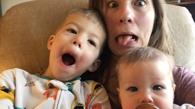 A woman taking a selfie with her kids because she realized how important it is to be in photos with ...