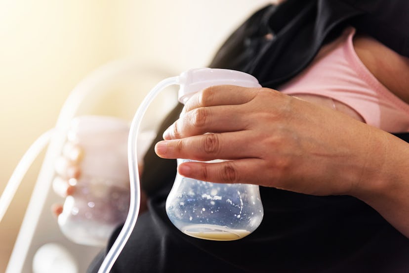 A woman with two breast pumps pumping milk at the office