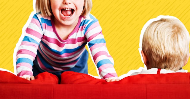 Two kids on the sofa, one kid is standing on it and assumed to be a spirited child, and the other is...