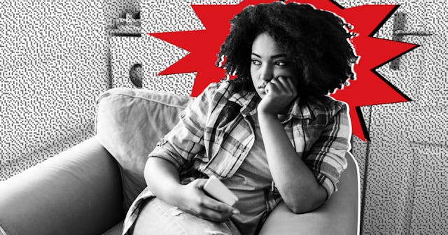 A woman with anxiety sitting in a chair with a phone in her hand in a black and white photo with a r...