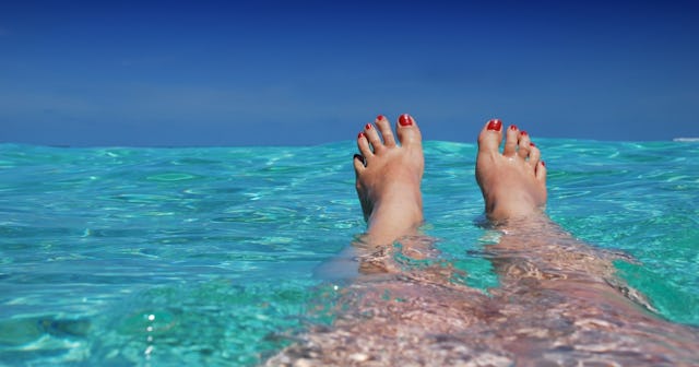 women's legs in ocean