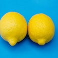 Two lemons leaned against each other