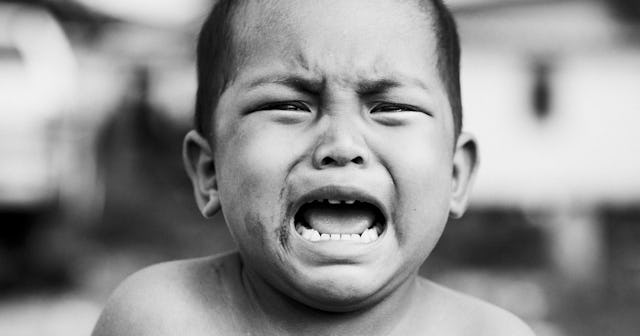 A little boy yelling resiliently