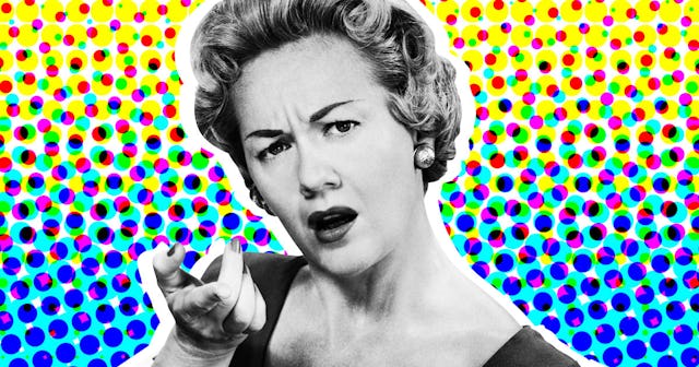 A woman with an angry facial expression pointing her index finger