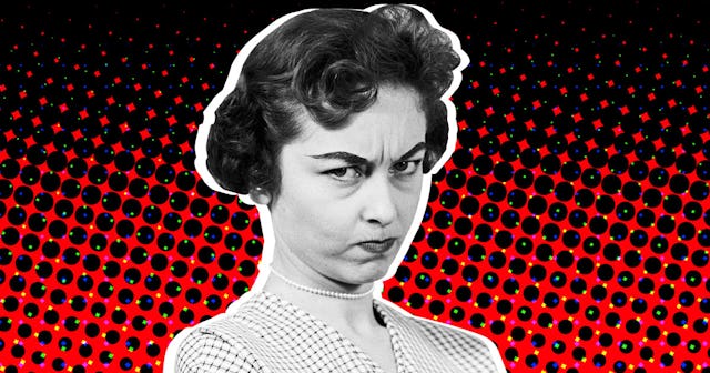 A woman with a 50's hairstyle with a red-black abstract background looking angry
