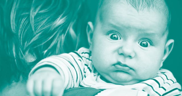 Mother holding her baby that has eyes bulging out