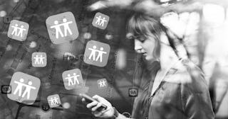 A young woman using a sharing location app