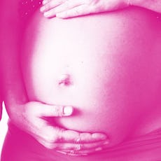 Two women standing next to each other with their hands on their baby bumps with a pink color filter