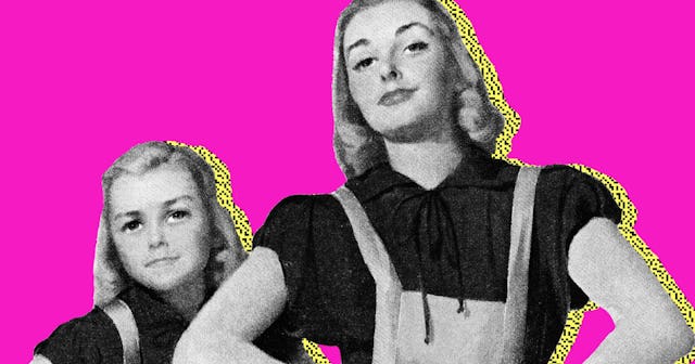 A blond woman in a black shirt and white overalls next to a child dressed the same way